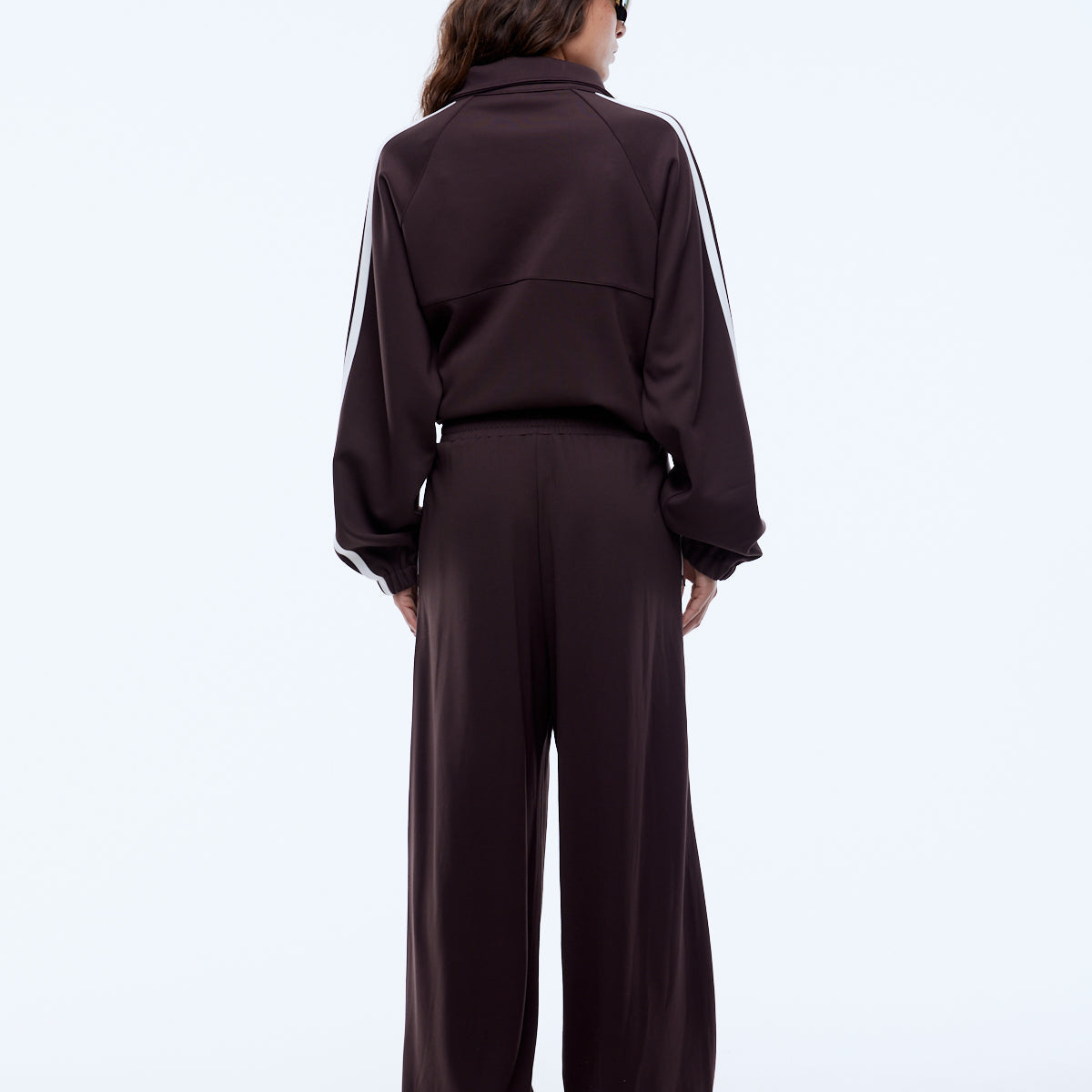 back view of Elasticated waistband and invisible zip pocket detail on Ena Pelly Valentina Stripe Pant cocoa