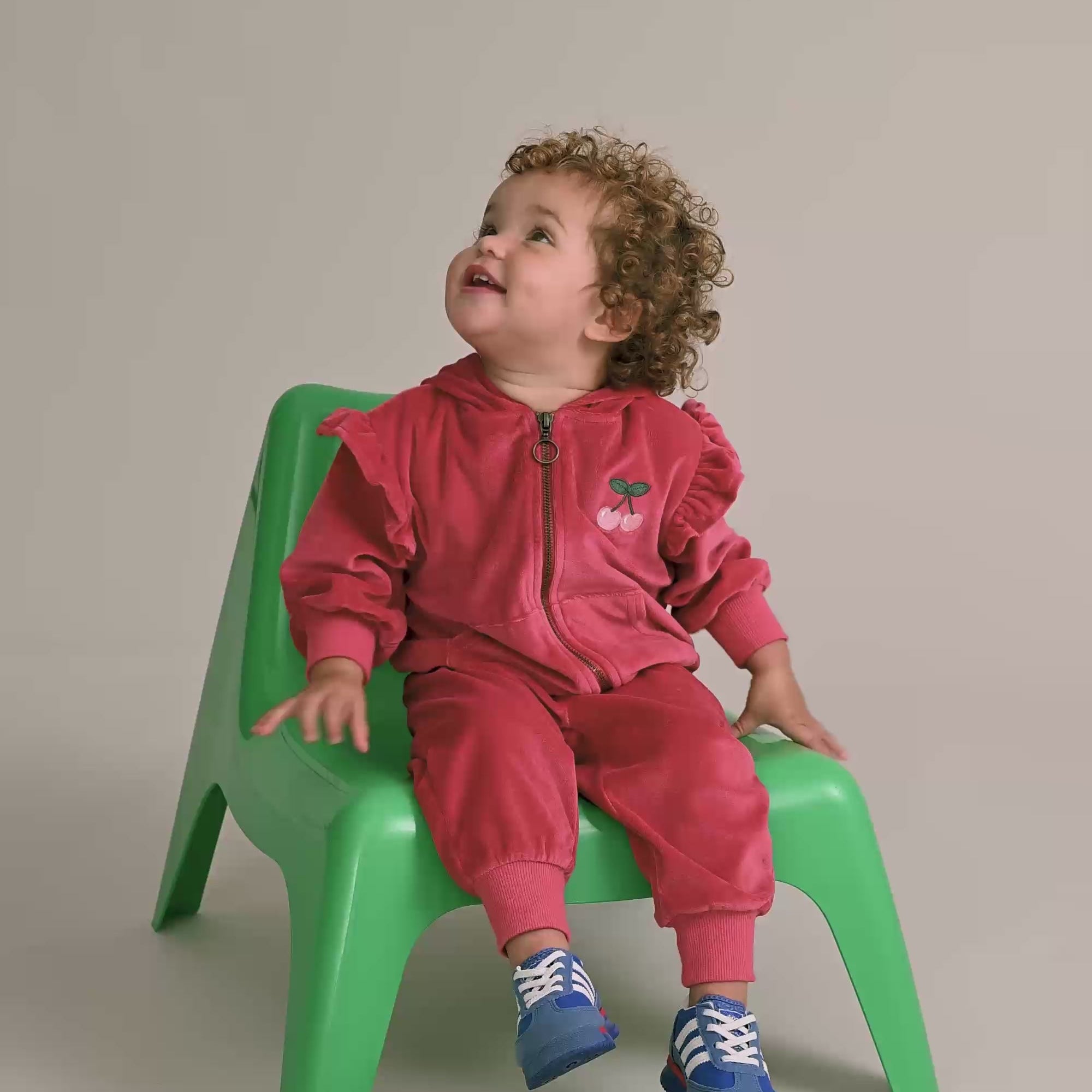 Young child wearing the matching set to the Very Cherry Velour Trackpant | Huxbaby