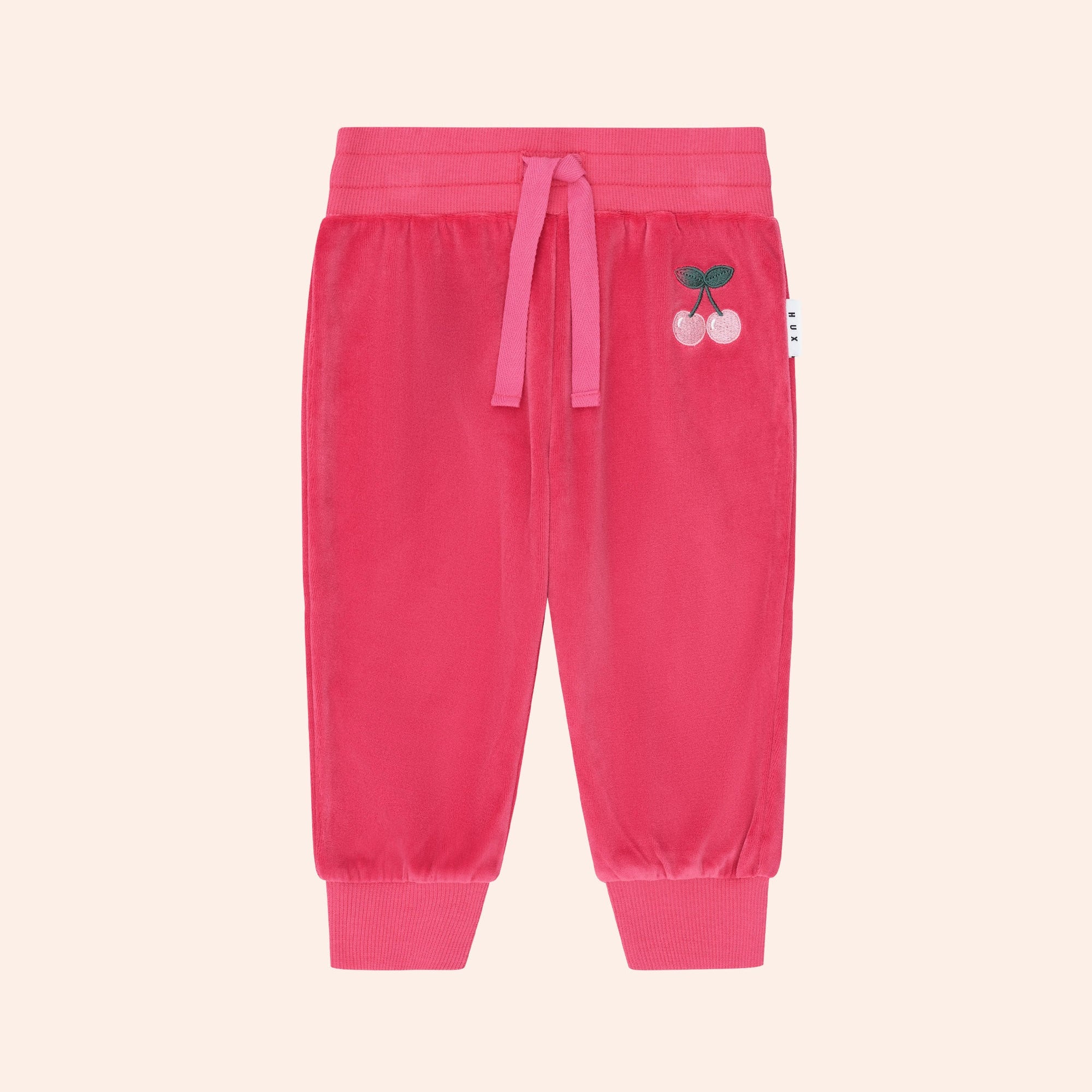 Front view of the Very Cherry Velour Trackpant | Huxbaby