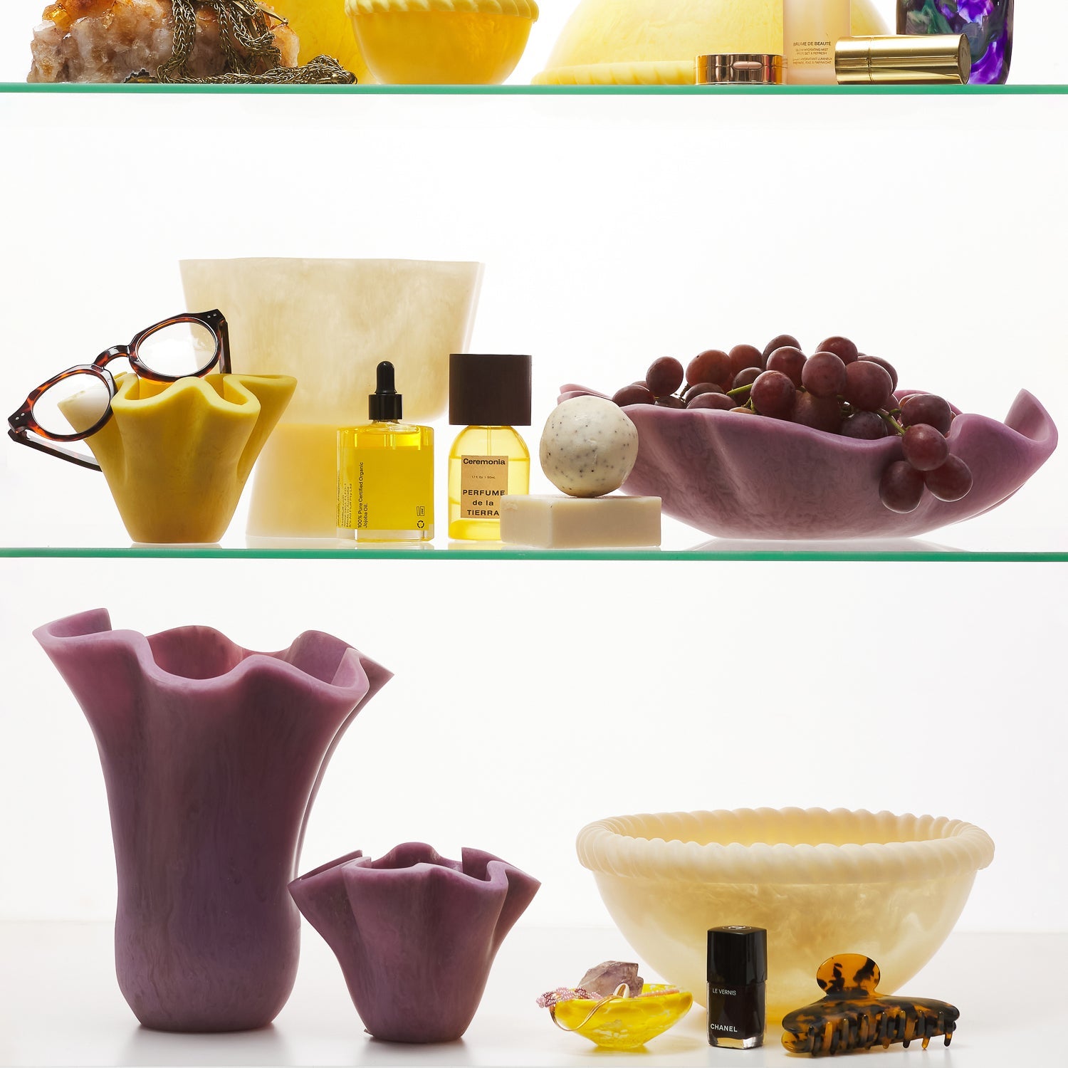 Orchid Violetta Vases in two sizes displayed on shelves alongside home and beauty accessories