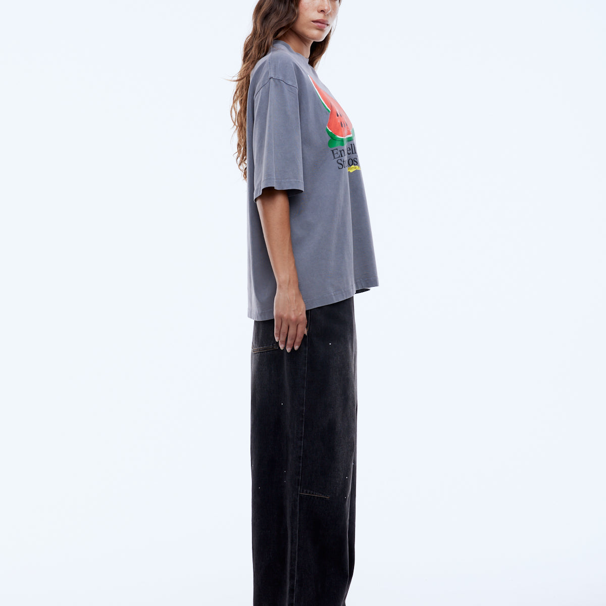 side detail of bold plastisol watermelon graphic on grey cotton tee