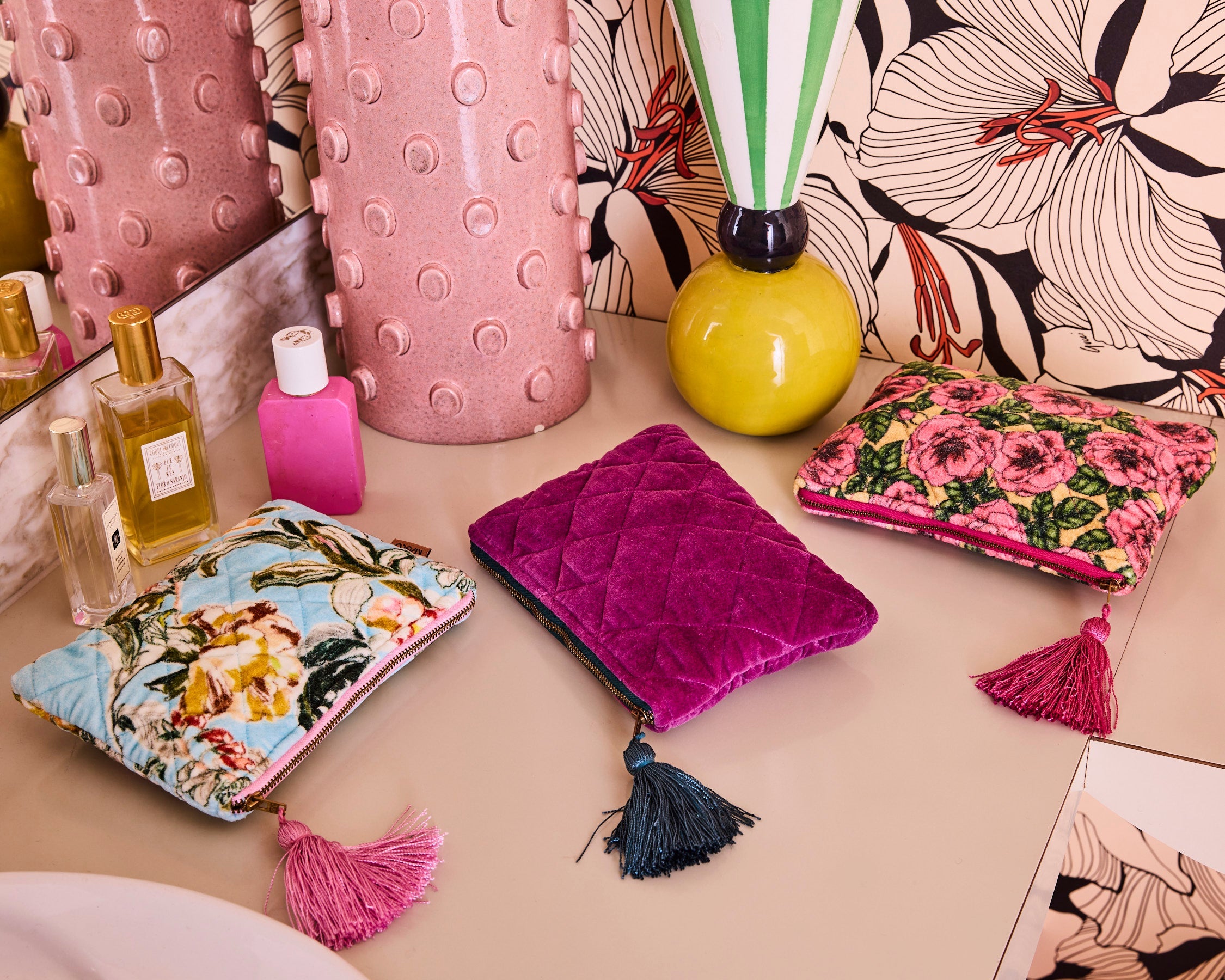 Close-up view of Wild Grape Velvet Cosmetics Purse showing quilted texture and decorative tassel detail