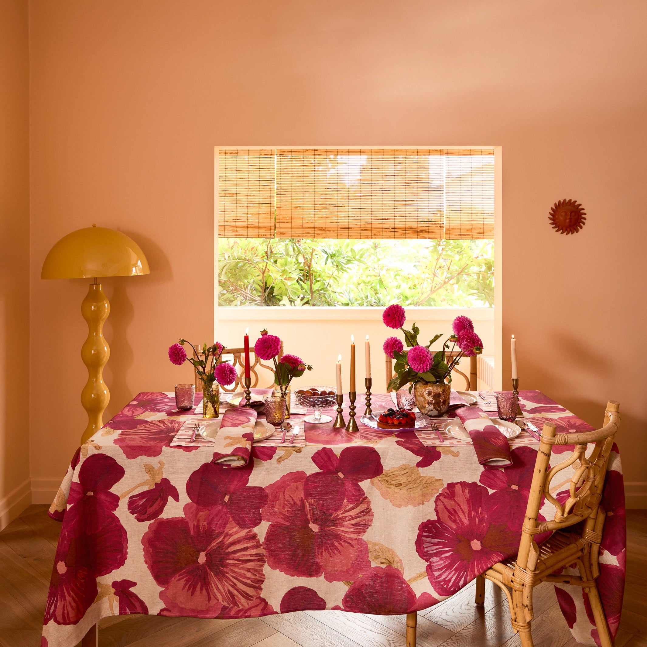 Full view of Wild Pansy Pink napkins as tablecloth with large floral print in dining room setting