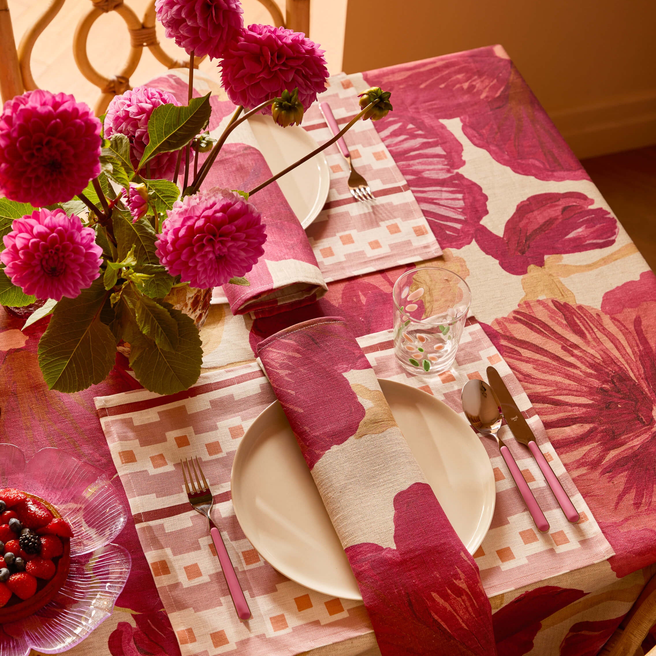 Overhead view of Wild Pansy Pink napkins in table setting with plates and glassware