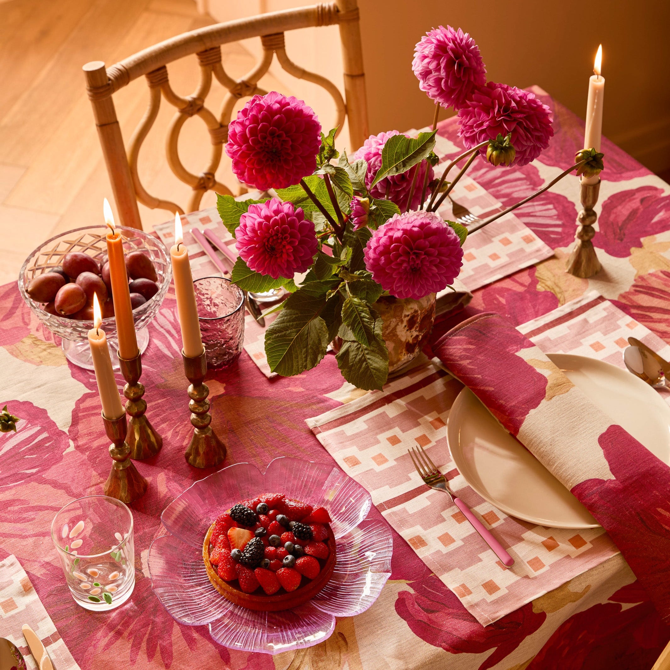 Wild Pansy Pink Tablecloth on dining table with floral centerpiece and table setting