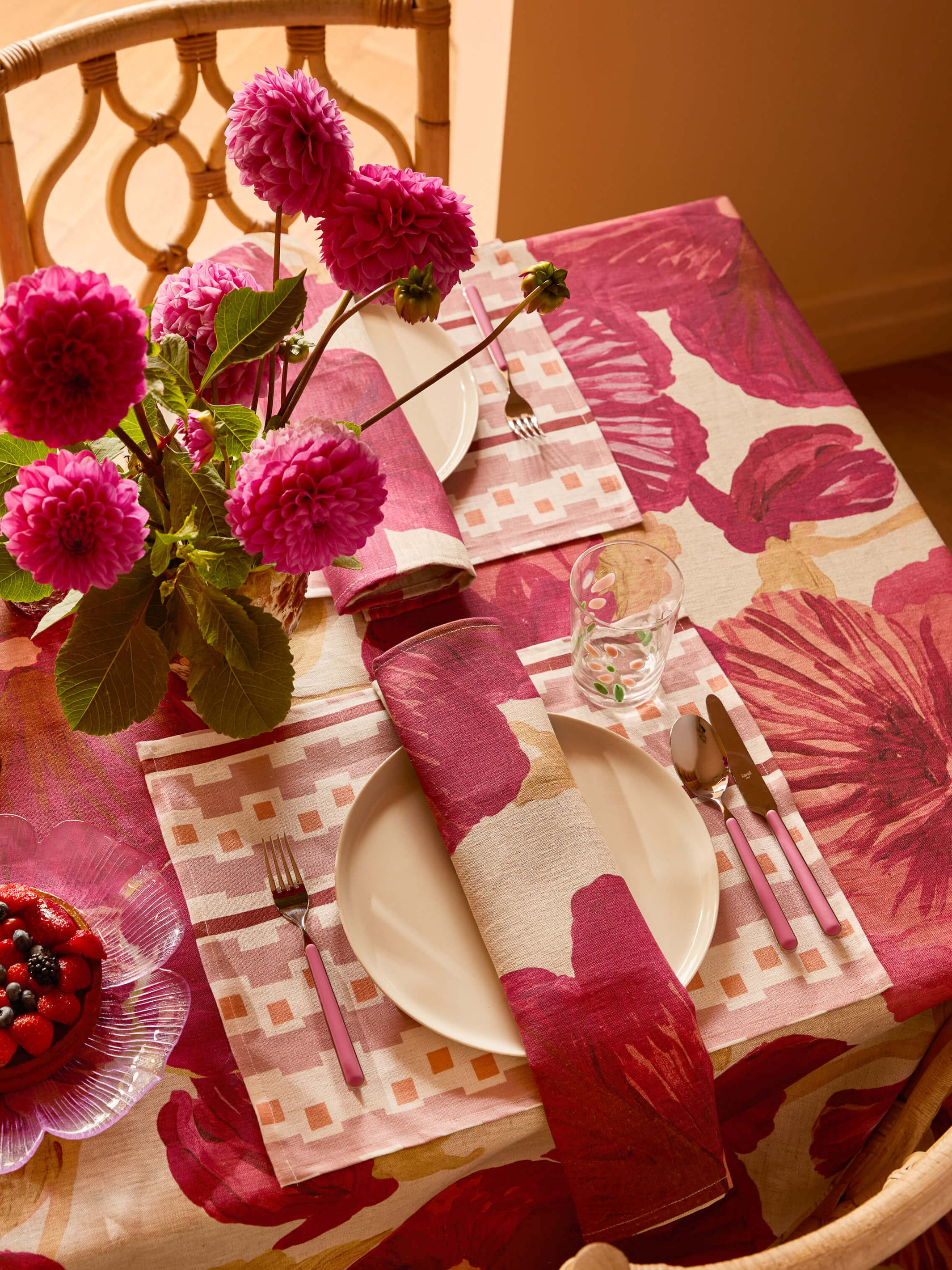 Close-up angled view of Wild Pansy Pink Tablecloth showing large floral pattern detail