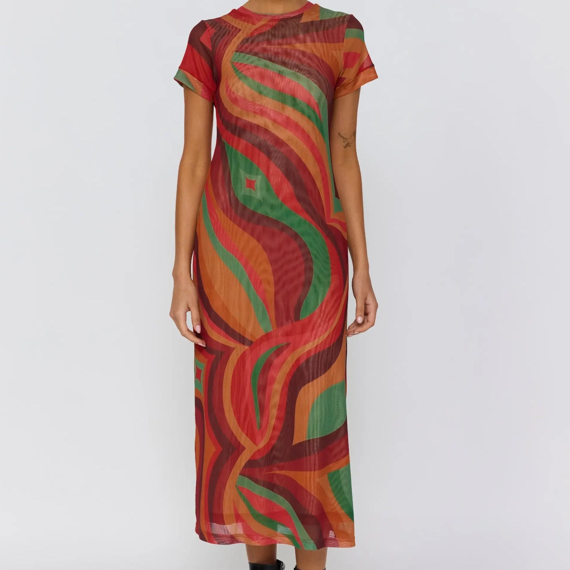Front view of Yoko Midi Dress showing vibrant swirl pattern in red orange and green tones