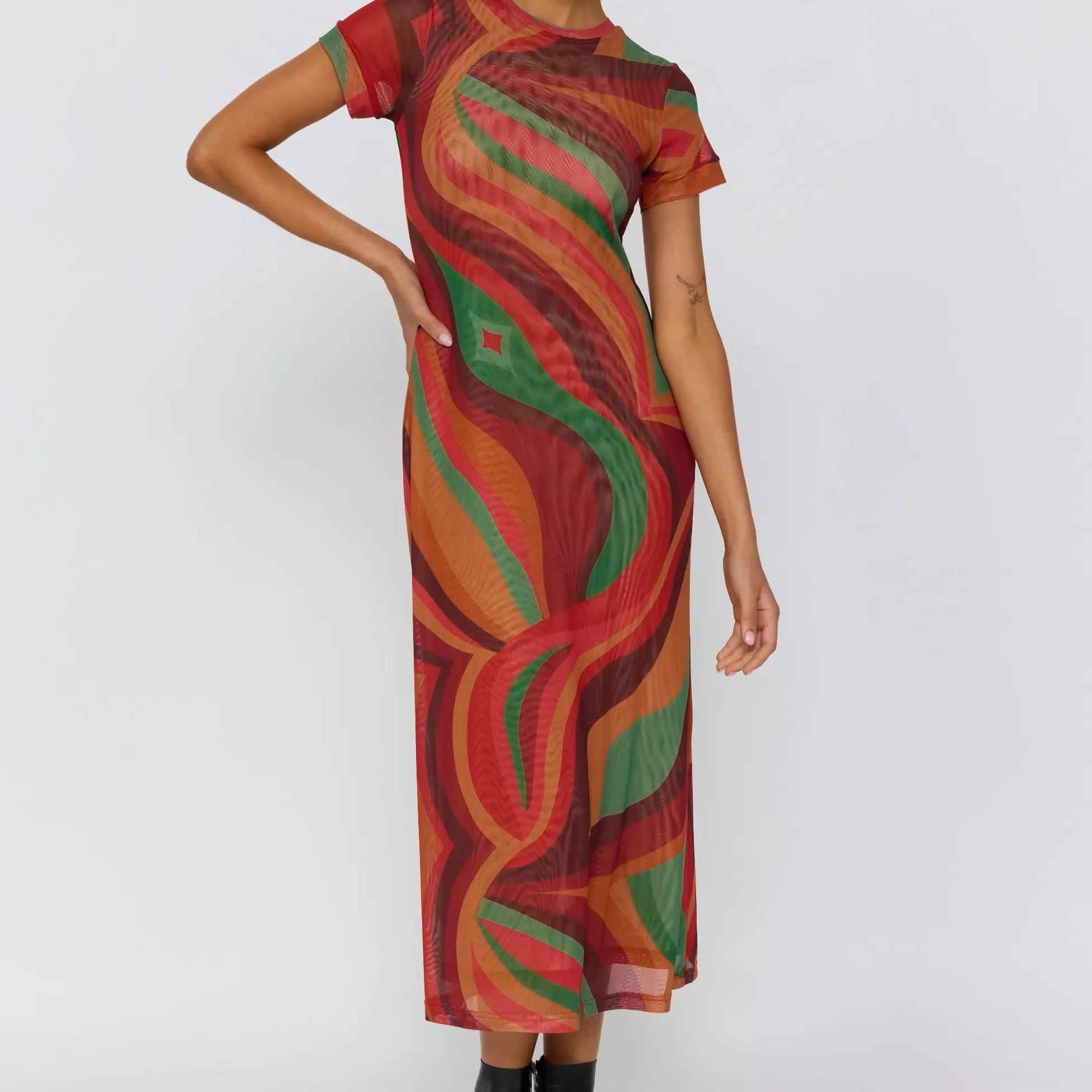 Three quarter view of Yoko Midi Dress featuring flowing swirl pattern and relaxed fit