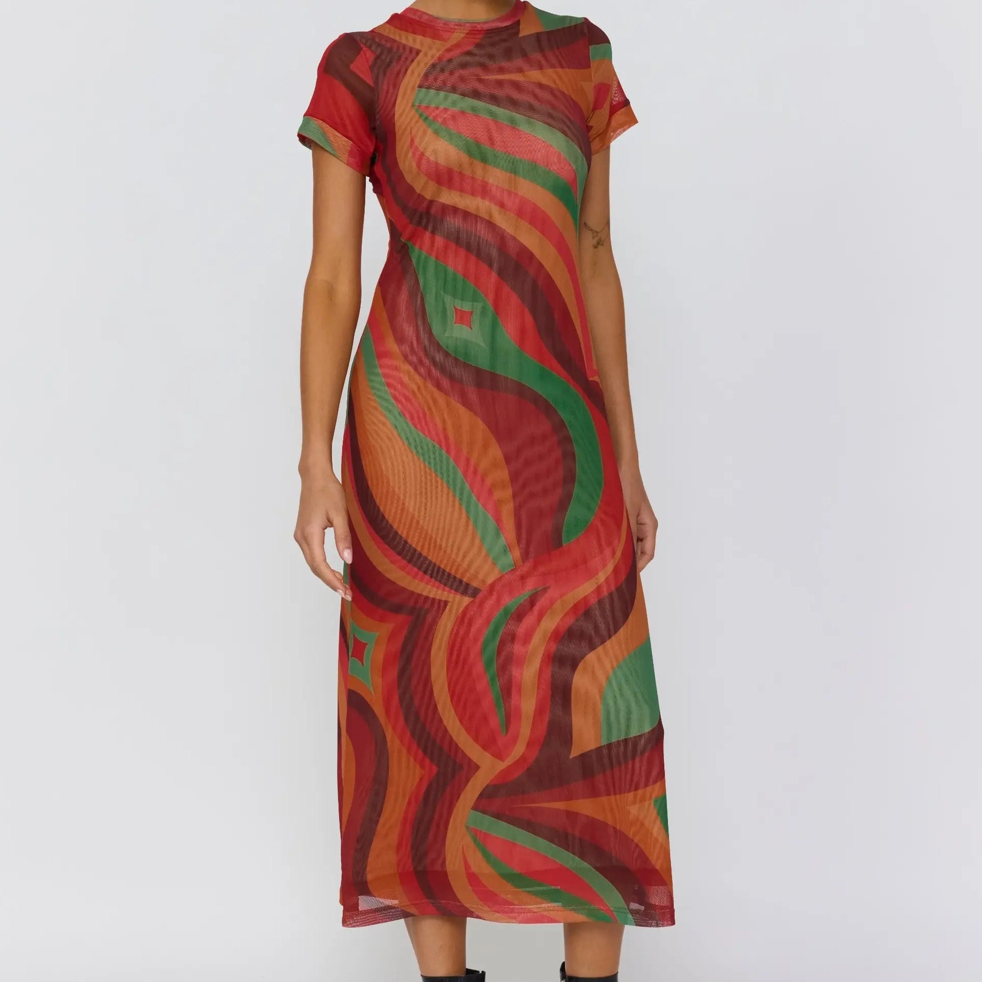 Side angle of Yoko Midi Dress showcasing curved wave print and semi sheer fabric
