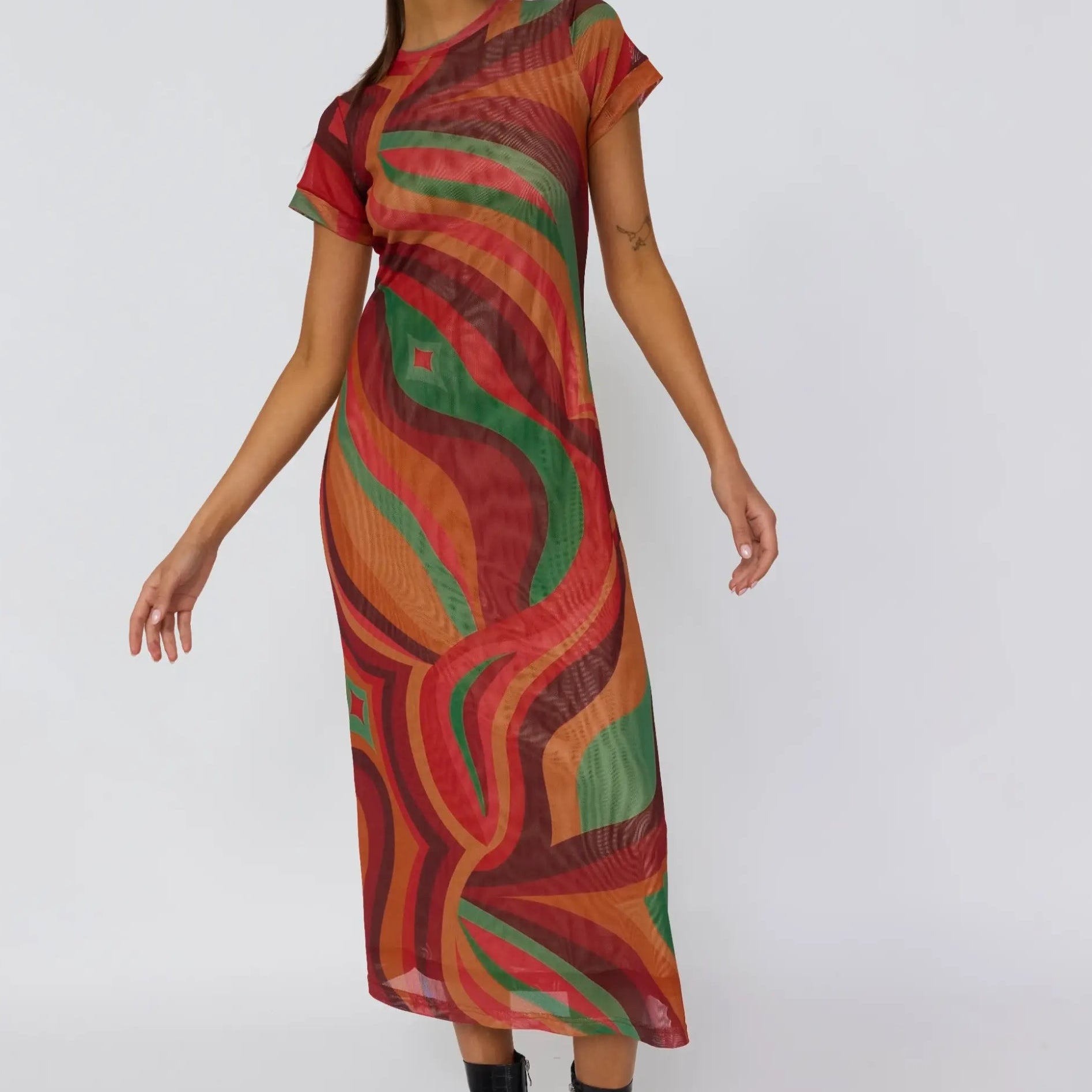 Dynamic side pose of Yoko Midi Dress highlighting fluid drape and vibrant crimson sun print
