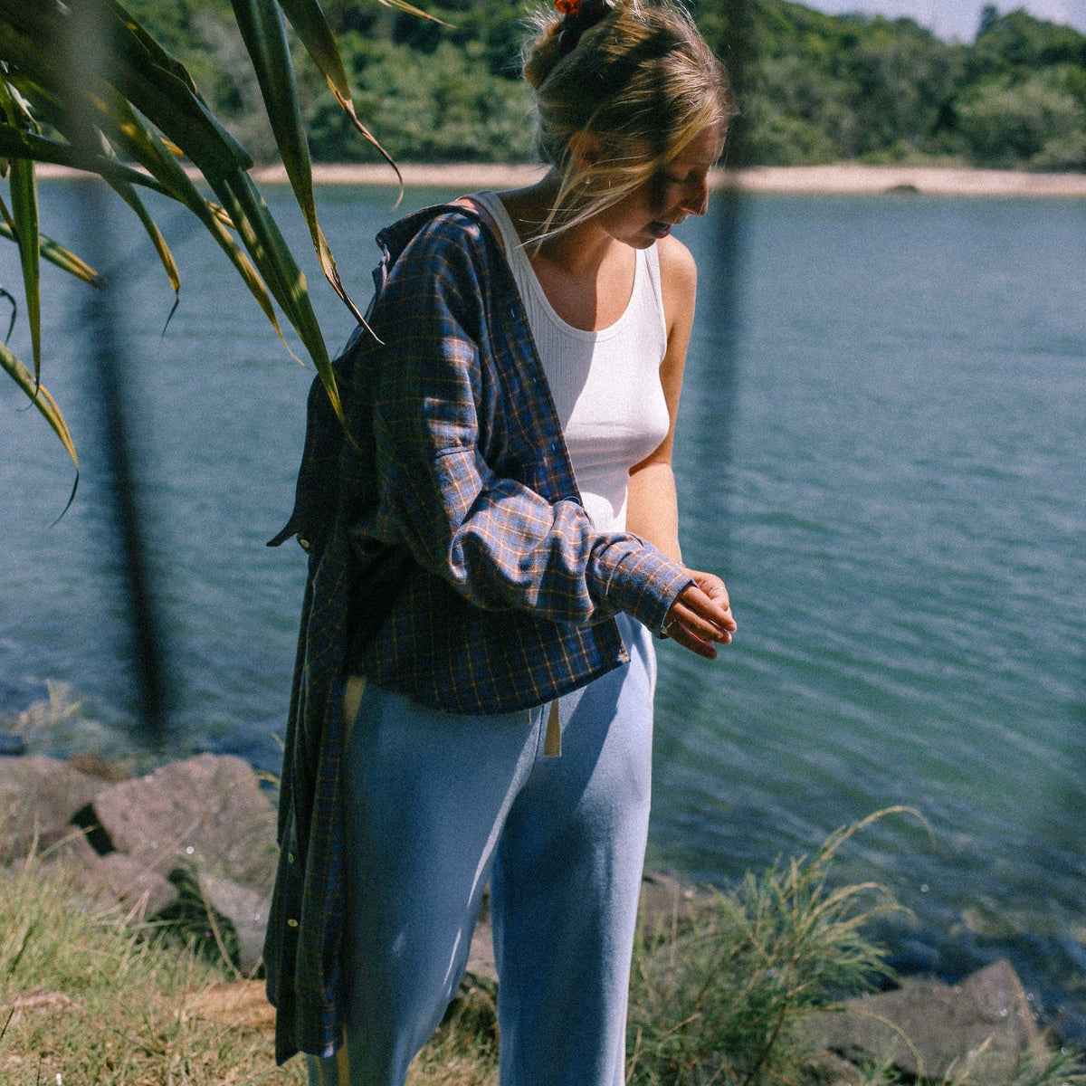 model at the beach wearing Apres Surf Pant Cloud by Atmosea