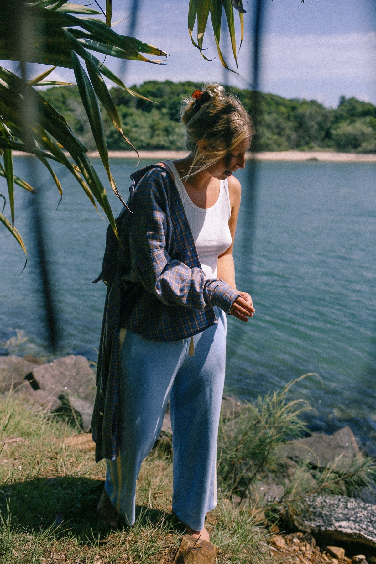 model at the beach wearing Apres Surf Pant Cloud by Atmosea