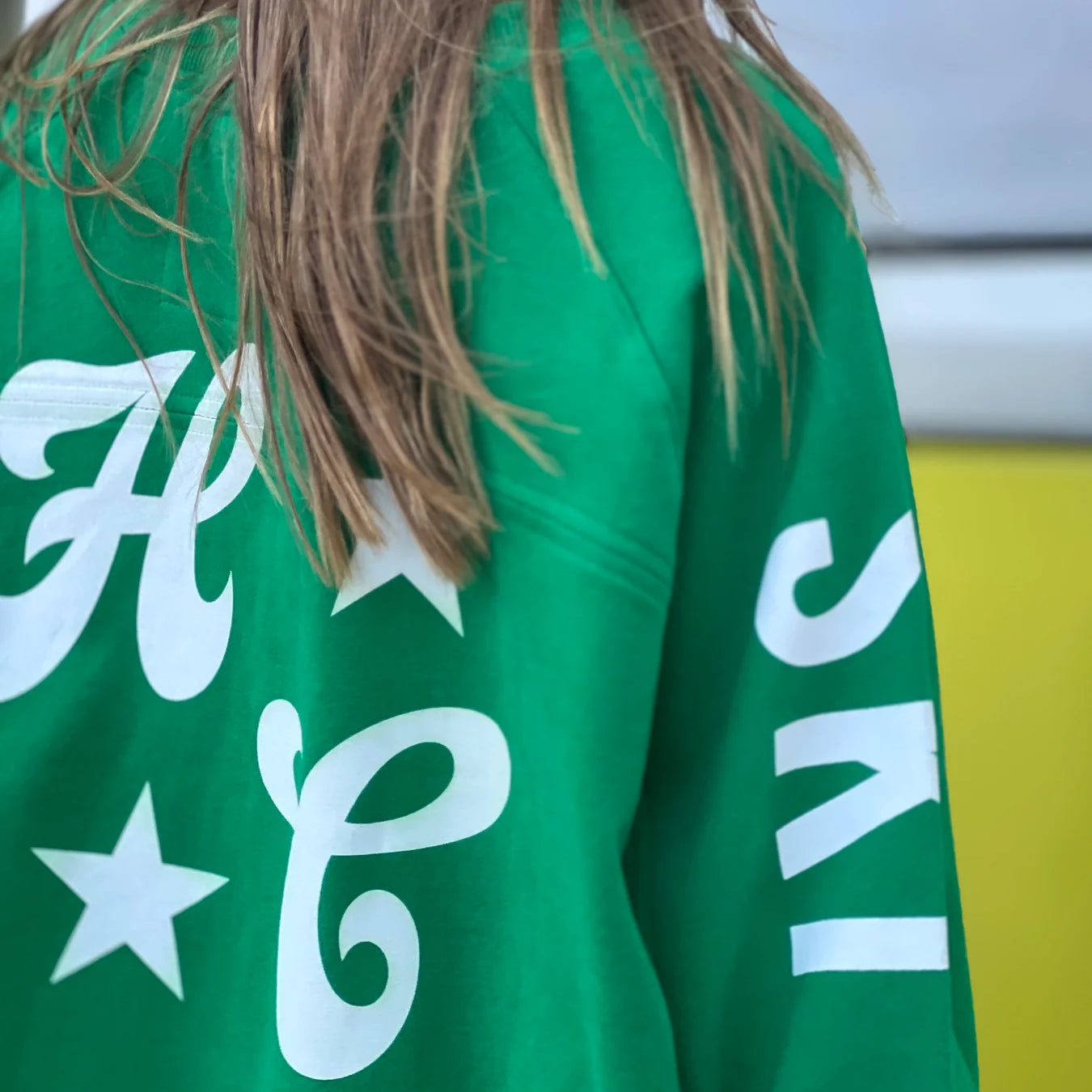 back detail of green oversized ski jumper by Hammill & Co