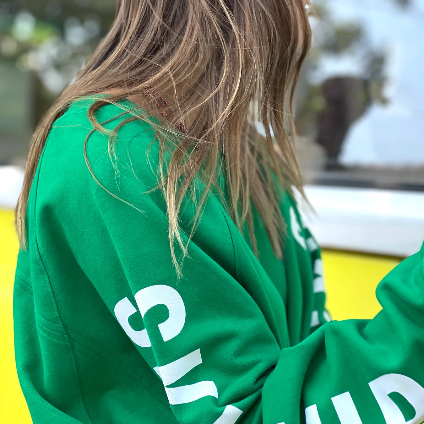 sleeve detail of green oversized ski jumper by Hammill & Co