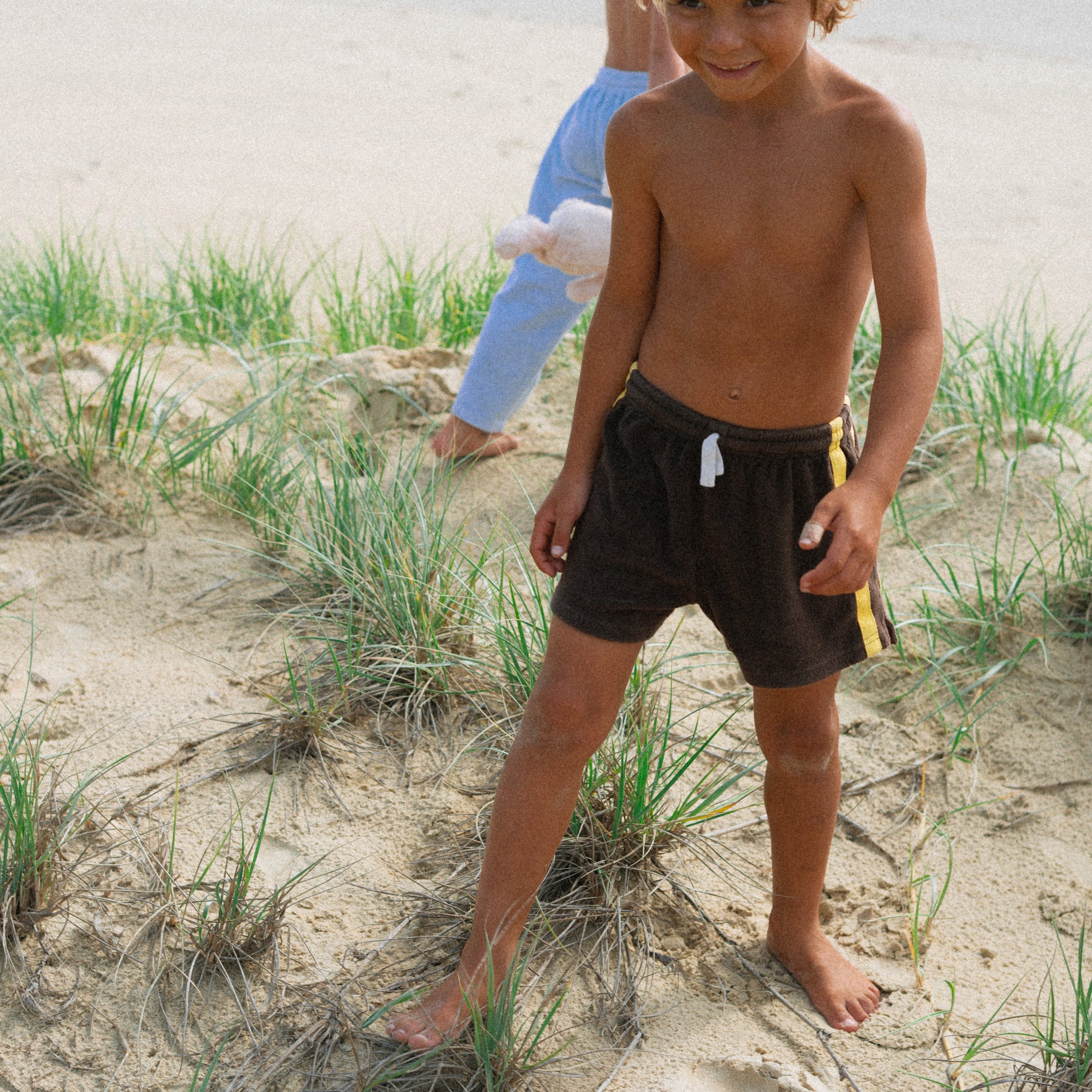 boy wearing brown Mini Terry Short by Chocolate Mango by Atmosea