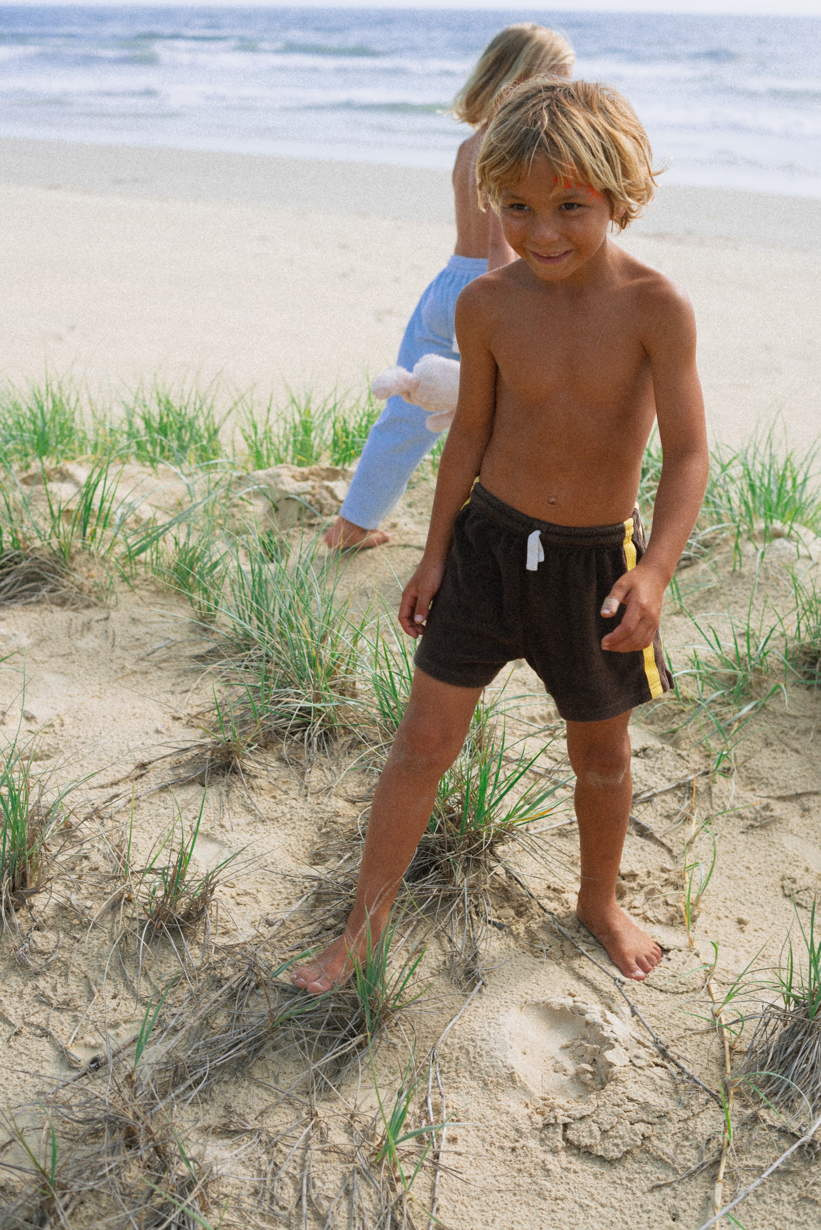 boy wearing brown Mini Terry Short by Chocolate Mango by Atmosea