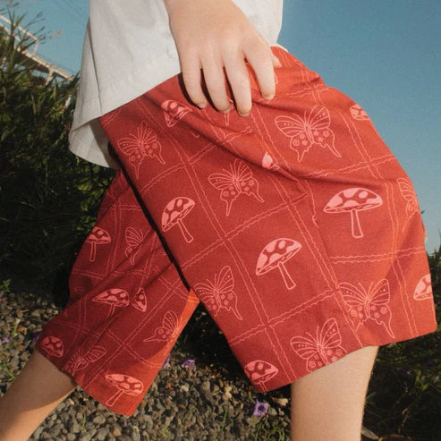 child wearing red Mushroom Pants by brand Sauce Mini