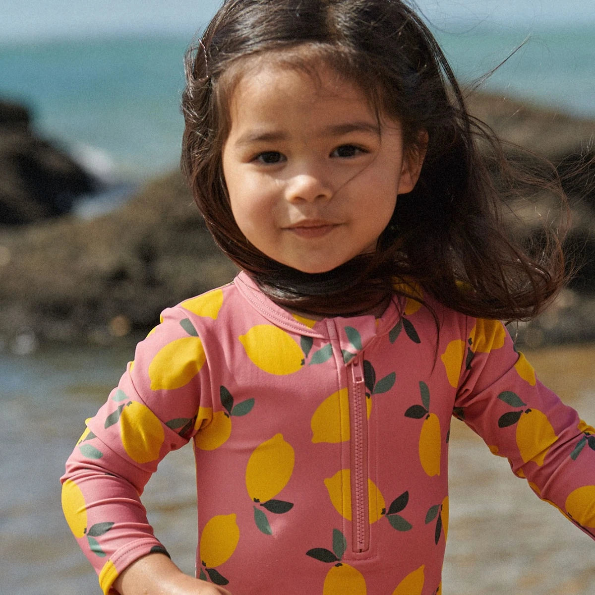 Girl wearing One Piece Bathing Trunks Lemmony Rose by Nature Baby