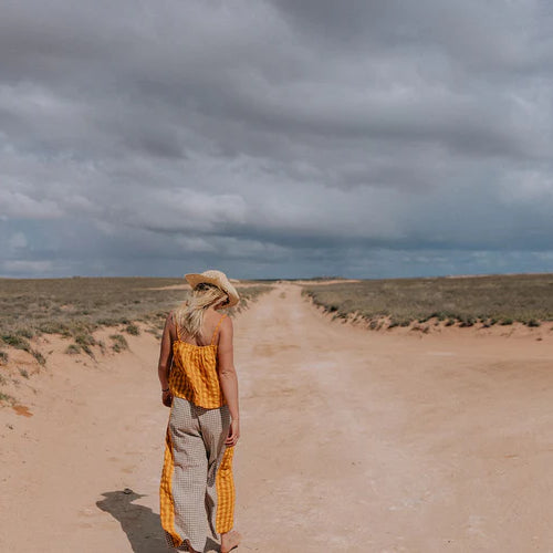 lady wearing yellow and brown patchwork pants by Atmosea