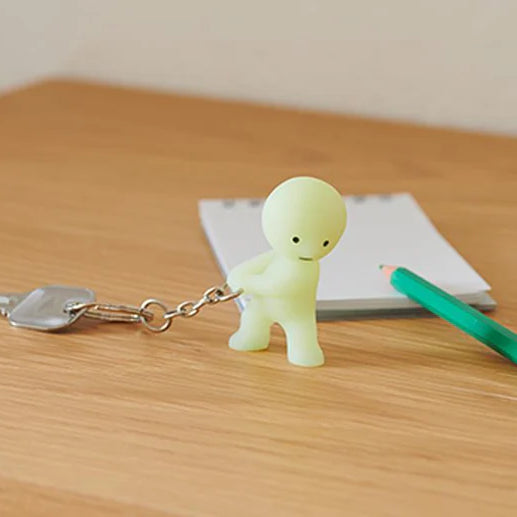 smiski keychain carrying the key