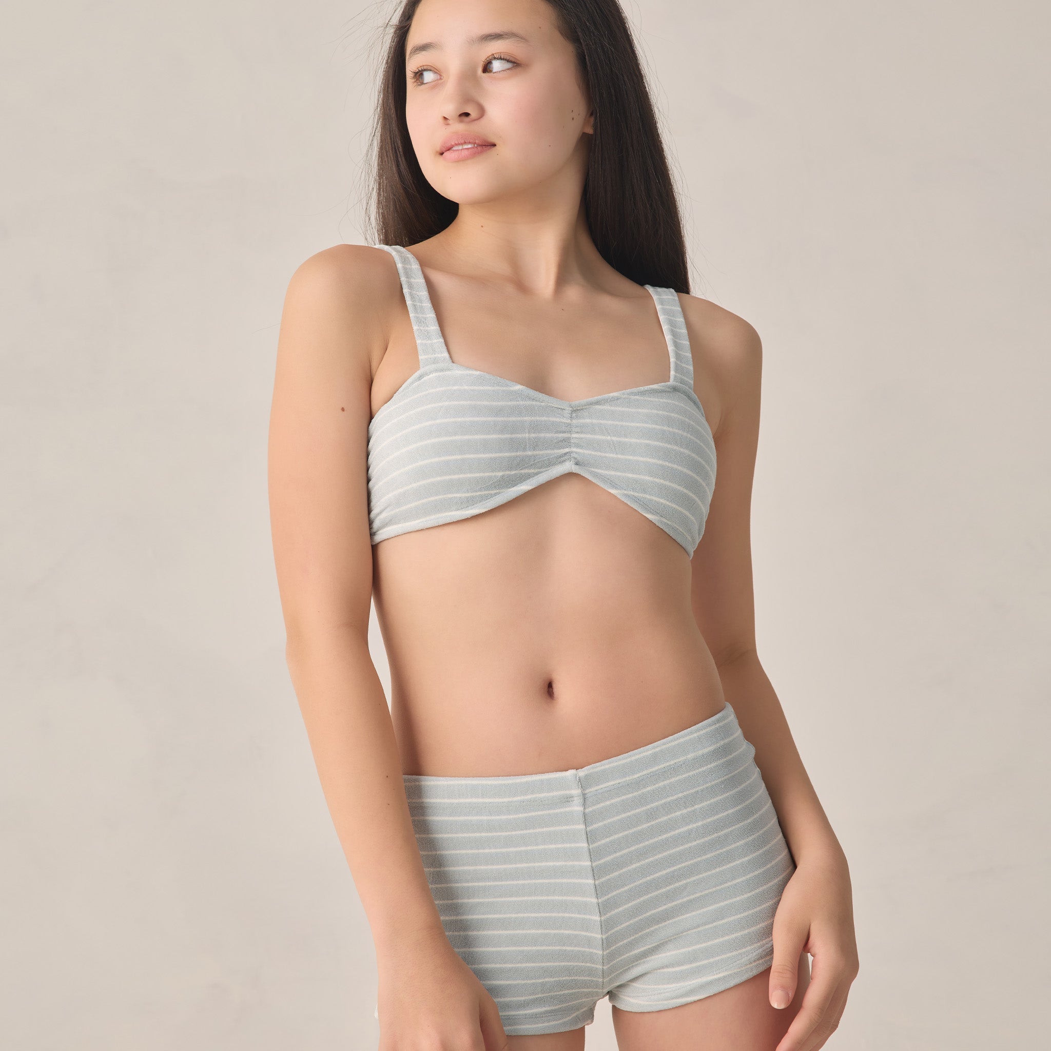 teen girl wearing blue and white stripe bikini by Rylee & Cru