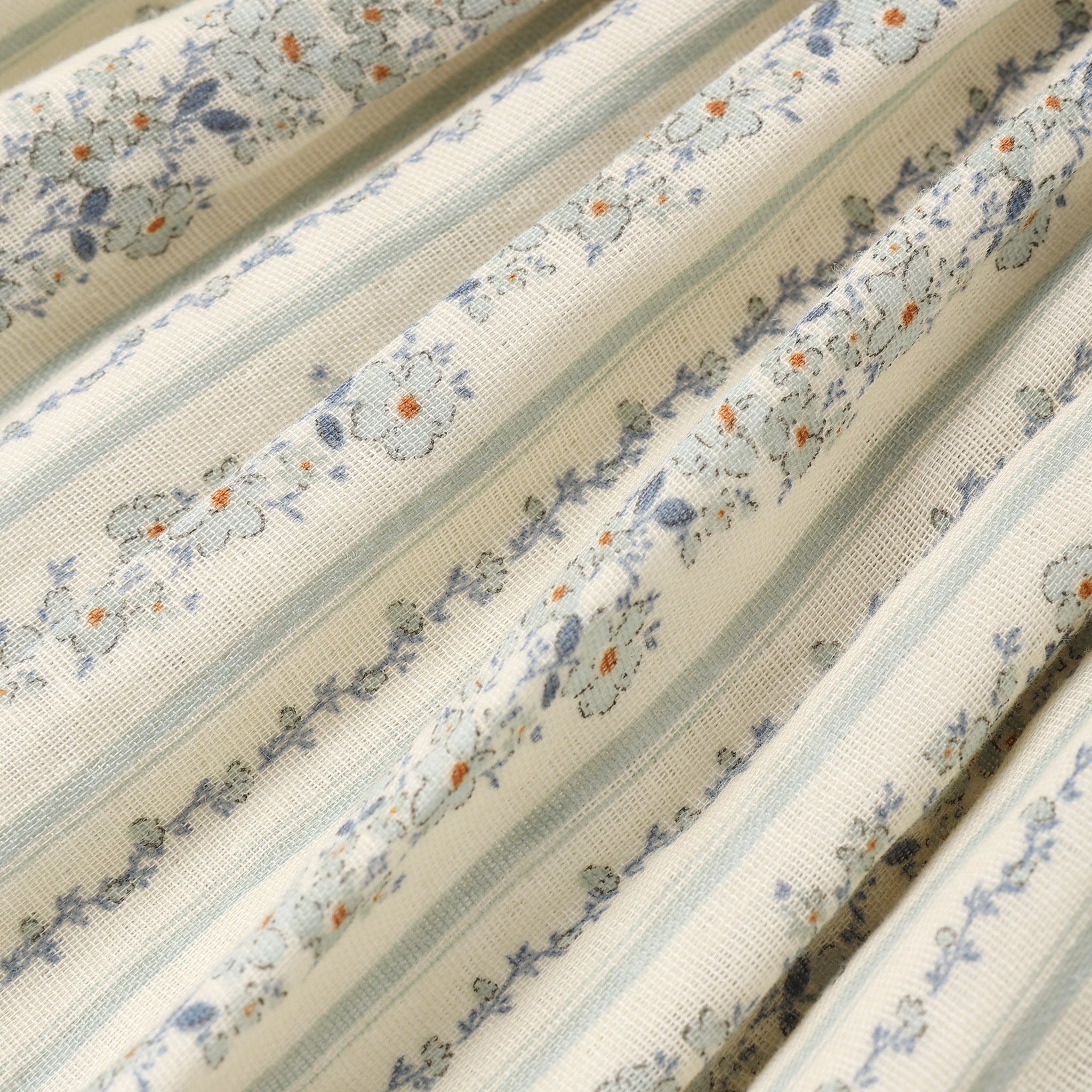 fabric detail of girl wearing Teen Daria Mini Dress Blue Floral by Rylee + Cru