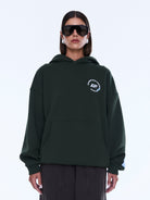 Front view of moss green Aries Hoodie with kangaroo pocket and relaxed fit