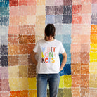 Lady wearing white cotton t-shirt with multicolour print Castle brand Australia