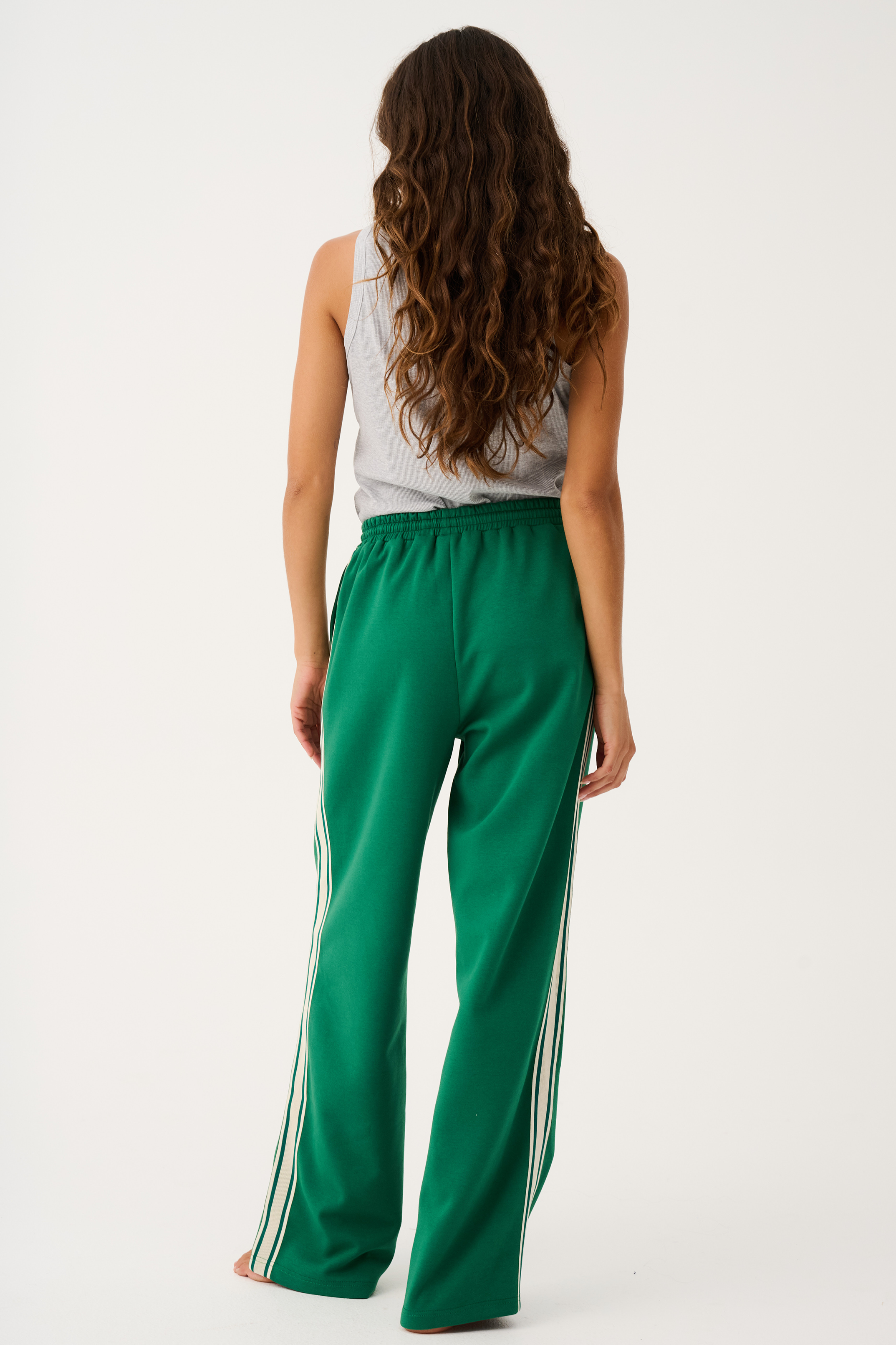 Back view of Adeline Pants showing elastic waistband and white side stripe detailing