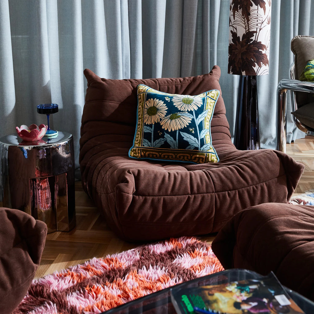 Aletha Velvet Cushion by Sage & Clare styled on brown lounge
