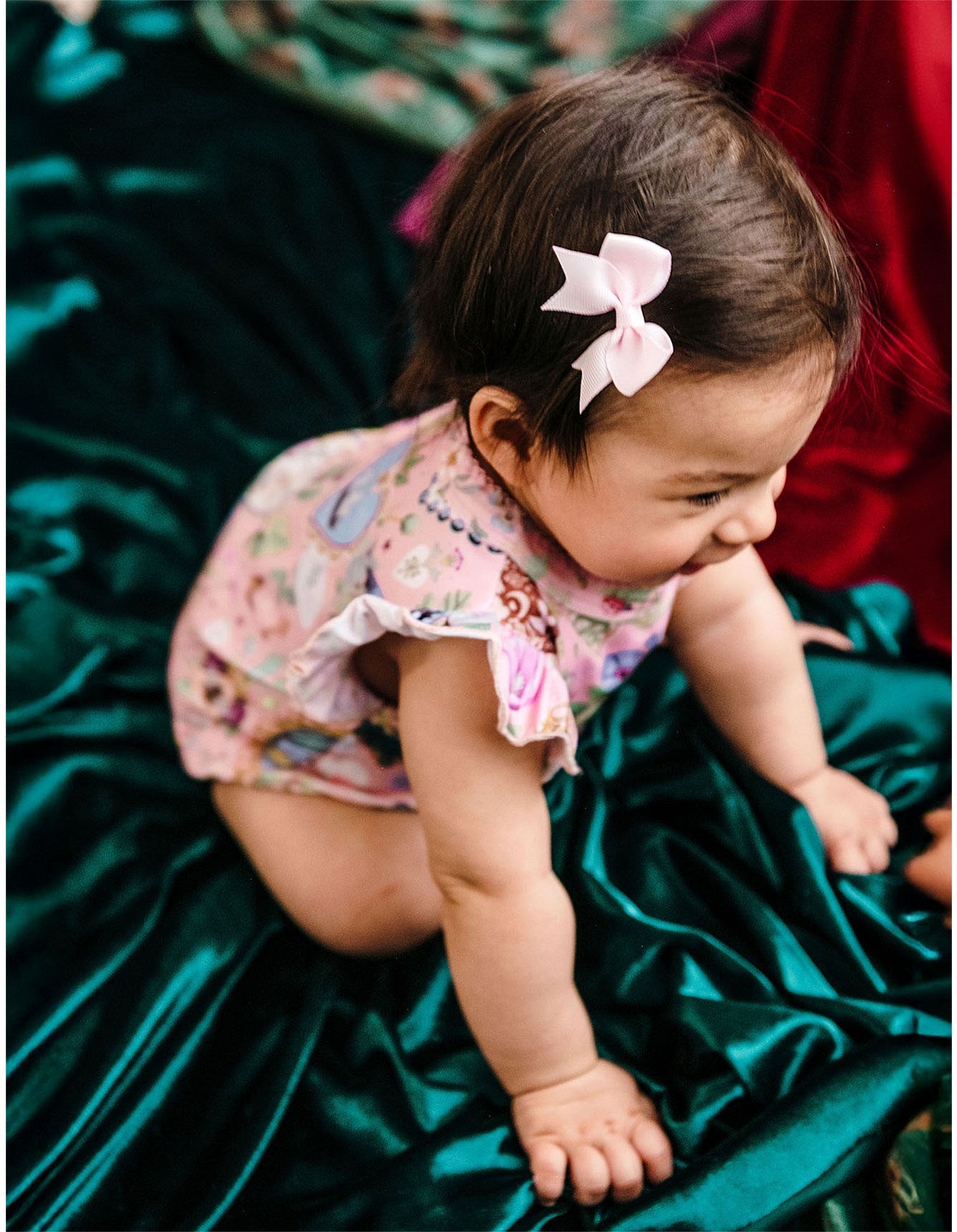 baby wearing All My Hearts Sweet Bubble Romper – Parfait Pink by Fleur Harris