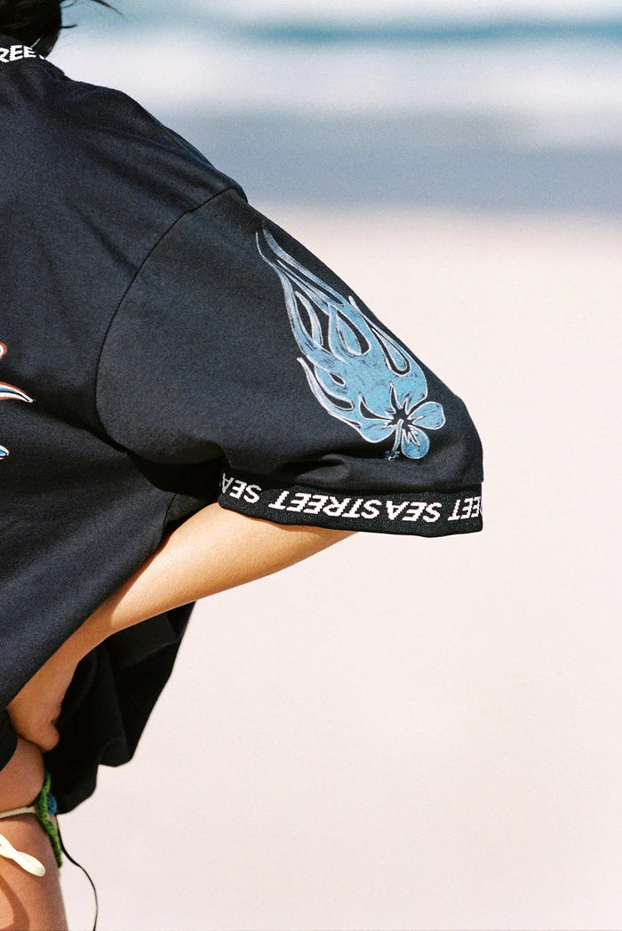 sleeve detail of the washed black Aloha Moto SS T-Shirt by Sea Street