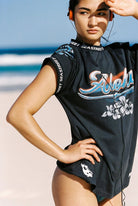 washed black tshirt by Sea Street with floral graphic and word "Aloha" across the front