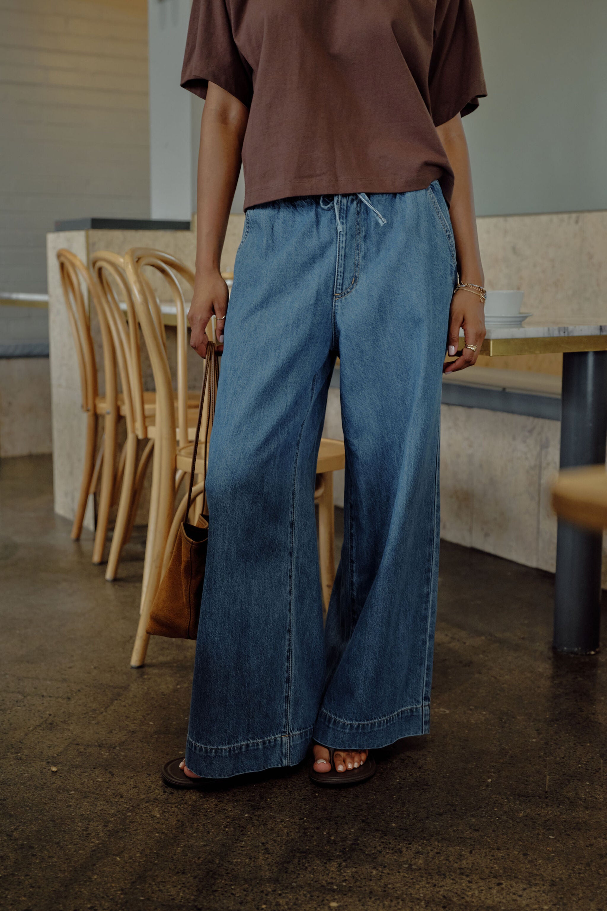 Side view of Andie Wide Leg Drawstring Pant in fresh indigo denim showing relaxed wide leg silhouette