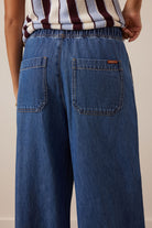 Close-up back view of Andie Wide Leg Drawstring Pant showing denim patch pockets and elastic waistband