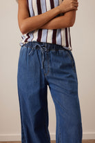 Detail of Andie Wide Leg Drawstring Pant waistband showing elastic and drawstring closure in fresh indigo