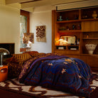 Folded view of Andrea Velvet Bedcover displaying both sides and corner detail with decorative fringe trim