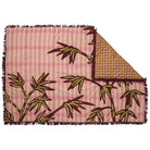 Aneta Tufted Blanket corner showing layered geometric and palm patterns with burgundy fringe detailing