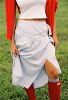 Side view of Annika Midi Skirt showing wrap style and blue striped fabric texture