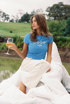 Front view of Star Baby Tee in azure blue showing white star print and fitted silhouette