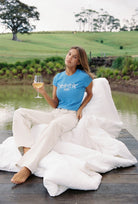 Star Baby Tee azure blue with white graphic design worn with relaxed styling outdoors