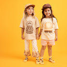 Two children wearing Banabae early riser tshirt