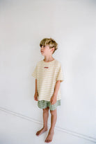boys green check shorts by Juni