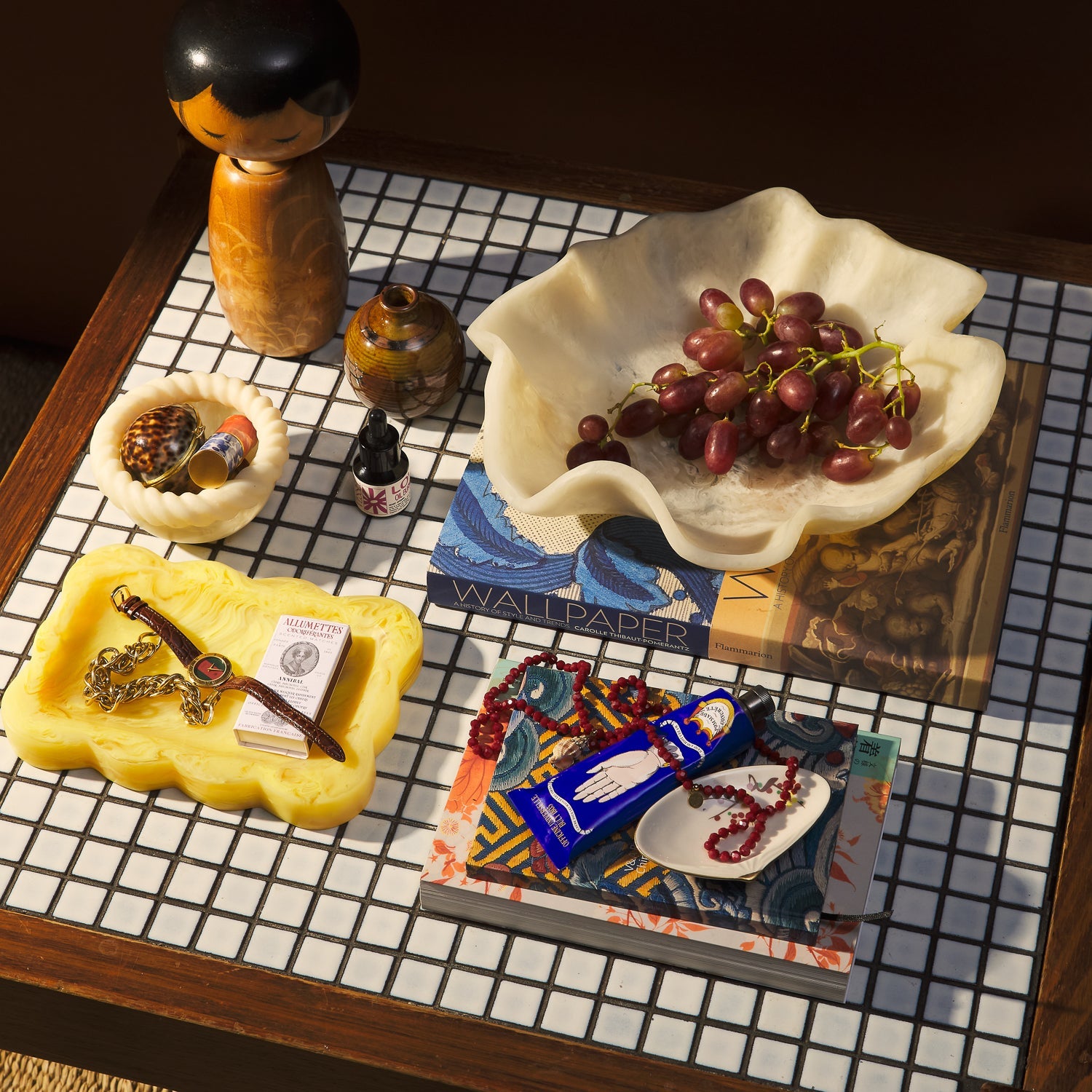 Aspen Gold marbled resin small tray with jewelry and matchbox, styled on a mosaic tile table with decorative objects