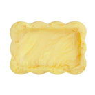 Aspen Gold yellow marbled resin small tray with scalloped wavy edge, overhead view on white background