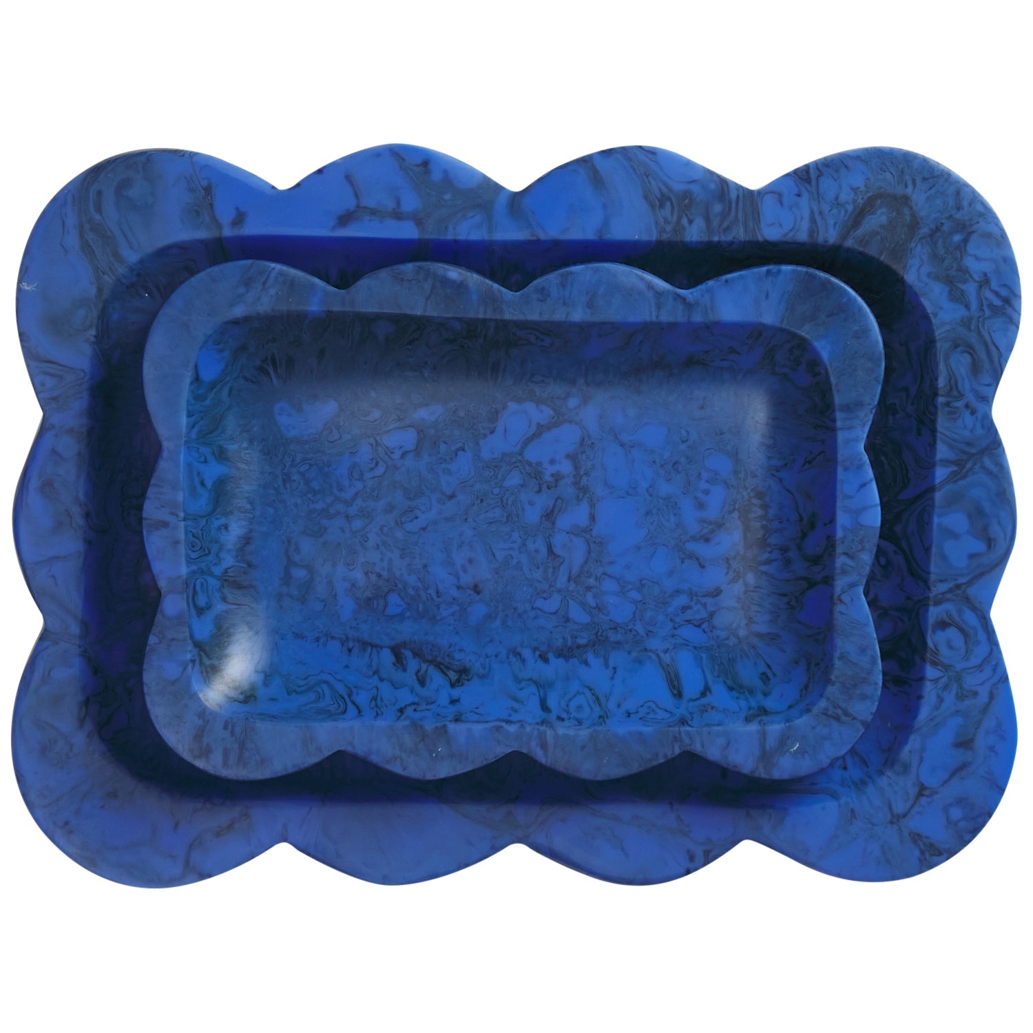Blue marbled resin small tray nested inside larger blue tray showing scalloped edge detail