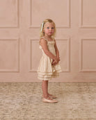 Girl wearing Birdie Dress Victorian Stripe by Noralee with smocked top