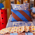 Blanca Ric Rac Cushion Blue Jay by Sage & Clare display on bed