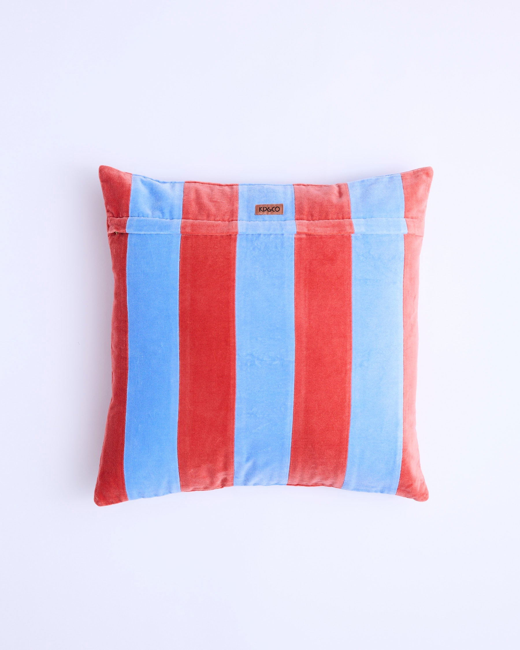 Blue Robin velvet cushion back view showing brand label and striped pattern