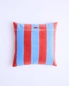 Blue Robin velvet cushion back view showing brand label and striped pattern